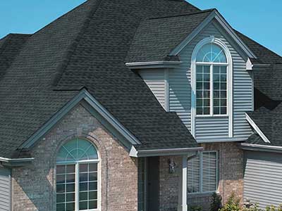 Mid-class home with black GAF shingles on its roof