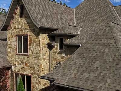 Mid-class home with earthy brown Tamko shingles on its roof